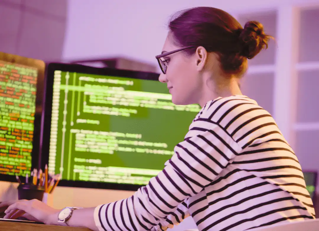 Career paths in software testing - lady at coding at a computer